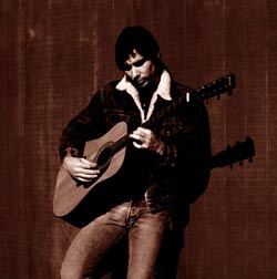 Coyote with his Alvarez 12-string guitar